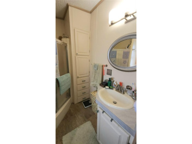 TWO BEDROOM, 1 1/2 BATHROOM MOBILE HOME IN ACTIVE 55+ COMMUNITY on River Run Golf Links in Florida - for sale on GolfHomes.com, golf home, golf lot