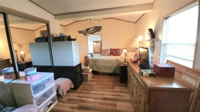 TWO BEDROOM, 1 1/2 BATHROOM MOBILE HOME IN ACTIVE 55+ COMMUNITY on River Run Golf Links in Florida - for sale on GolfHomes.com, golf home, golf lot