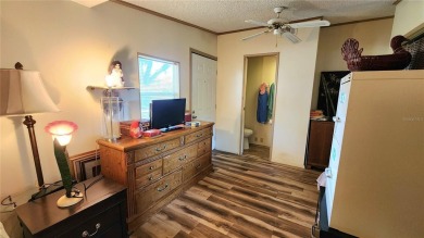 TWO BEDROOM, 1 1/2 BATHROOM MOBILE HOME IN ACTIVE 55+ COMMUNITY on River Run Golf Links in Florida - for sale on GolfHomes.com, golf home, golf lot