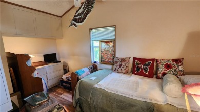 TWO BEDROOM, 1 1/2 BATHROOM MOBILE HOME IN ACTIVE 55+ COMMUNITY on River Run Golf Links in Florida - for sale on GolfHomes.com, golf home, golf lot