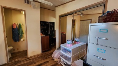 TWO BEDROOM, 1 1/2 BATHROOM MOBILE HOME IN ACTIVE 55+ COMMUNITY on River Run Golf Links in Florida - for sale on GolfHomes.com, golf home, golf lot