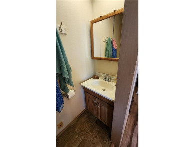 TWO BEDROOM, 1 1/2 BATHROOM MOBILE HOME IN ACTIVE 55+ COMMUNITY on River Run Golf Links in Florida - for sale on GolfHomes.com, golf home, golf lot