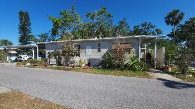 TWO BEDROOM, 1 1/2 BATHROOM MOBILE HOME IN ACTIVE 55+ COMMUNITY on River Run Golf Links in Florida - for sale on GolfHomes.com, golf home, golf lot