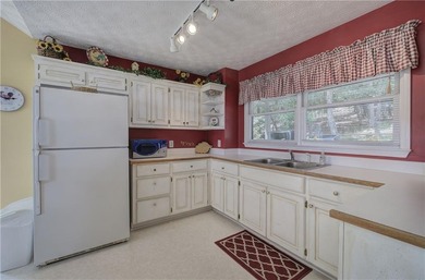 Step into this inviting ranch-style home, filled with natural on Bent Tree Golf Course in Georgia - for sale on GolfHomes.com, golf home, golf lot