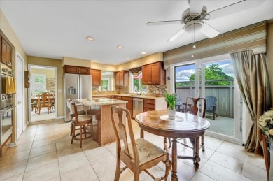 End-Unit Luxury with Golf Views, Abundant Light & Private Gate on Lake Barrington Shores Golf Course in Illinois - for sale on GolfHomes.com, golf home, golf lot