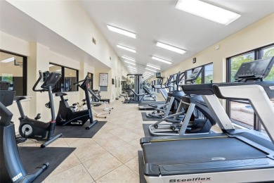 Under contract-accepting backup offers. Welcome to resort-style on Feather Sound Country Club in Florida - for sale on GolfHomes.com, golf home, golf lot