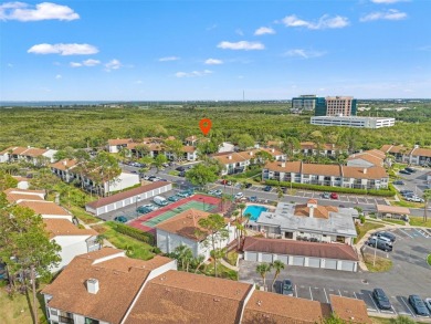 Under contract-accepting backup offers. Welcome to resort-style on Feather Sound Country Club in Florida - for sale on GolfHomes.com, golf home, golf lot