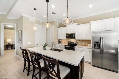 Enjoy stunning Naples sunsets from your private lanai in this on The Golf Lodge At the Quarry in Florida - for sale on GolfHomes.com, golf home, golf lot