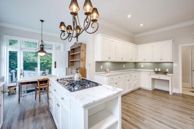 Nestled privately on coveted Charles Towne Place - a quiet on Woodside Plantation Country Club in South Carolina - for sale on GolfHomes.com, golf home, golf lot