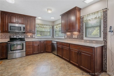 Live the dream in this stunning home on the golf course just on Cypress Lakes Golf Course in North Carolina - for sale on GolfHomes.com, golf home, golf lot