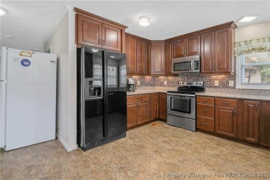 Live the dream in this stunning home on the golf course just on Cypress Lakes Golf Course in North Carolina - for sale on GolfHomes.com, golf home, golf lot