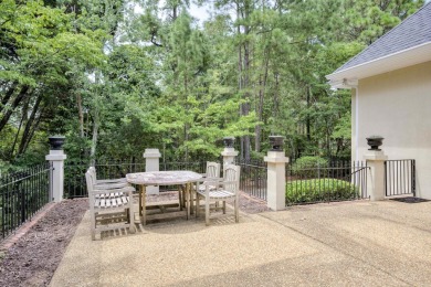 Nestled privately on coveted Charles Towne Place - a quiet on Woodside Plantation Country Club in South Carolina - for sale on GolfHomes.com, golf home, golf lot