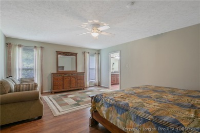 Live the dream in this stunning home on the golf course just on Cypress Lakes Golf Course in North Carolina - for sale on GolfHomes.com, golf home, golf lot