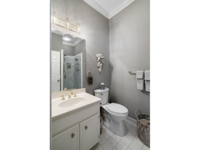 Nestled privately on coveted Charles Towne Place - a quiet on Woodside Plantation Country Club in South Carolina - for sale on GolfHomes.com, golf home, golf lot