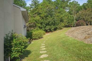 Nestled privately on coveted Charles Towne Place - a quiet on Woodside Plantation Country Club in South Carolina - for sale on GolfHomes.com, golf home, golf lot