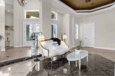 Luxurious lakeside living beckons you to your own private on Deer Island Country Club in Florida - for sale on GolfHomes.com, golf home, golf lot