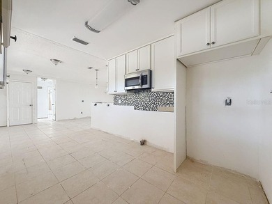 Perfect for Investors or for you who wants to make this property on Mangrove Bay Golf Course in Florida - for sale on GolfHomes.com, golf home, golf lot