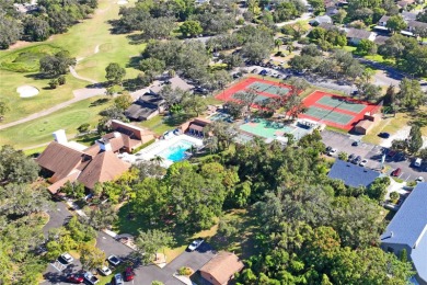 Welcome to this beautifully landscaped corner lot home located on Beacon Woods Golf Club in Florida - for sale on GolfHomes.com, golf home, golf lot