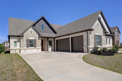 Experience resort-style living in this stunning 4-bedroom, 2 on The Golf Club at Resort Eagle Mountain Lake in Texas - for sale on GolfHomes.com, golf home, golf lot