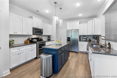 Welcome to 3204 Carnoustie, a beautifully appointed home located on Gates Four Golf and Country Club in North Carolina - for sale on GolfHomes.com, golf home, golf lot