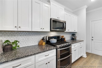 Welcome to 3204 Carnoustie, a beautifully appointed home located on Gates Four Golf and Country Club in North Carolina - for sale on GolfHomes.com, golf home, golf lot