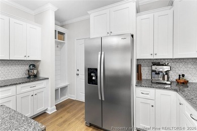 Welcome to 3204 Carnoustie, a beautifully appointed home located on Gates Four Golf and Country Club in North Carolina - for sale on GolfHomes.com, golf home, golf lot