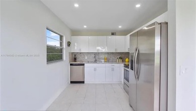 Buyer fell through--this beautifully updated corner unit is on Flamingo Lakes Country Club in Florida - for sale on GolfHomes.com, golf home, golf lot