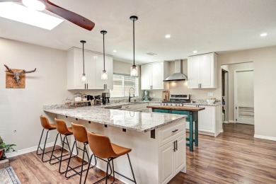 Welcome to this charming home offering tons of updates! Enter on Arroyo Del Oso Golf Course in New Mexico - for sale on GolfHomes.com, golf home, golf lot