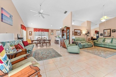 From the moment you approach, this radiant home invites you into on Cypress Lakes Golf Course - West Palm Beach in Florida - for sale on GolfHomes.com, golf home, golf lot