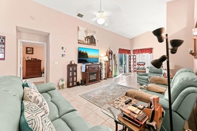 From the moment you approach, this radiant home invites you into on Cypress Lakes Golf Course - West Palm Beach in Florida - for sale on GolfHomes.com, golf home, golf lot