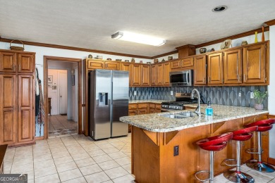 This beautiful ranch-styled home is nestled in the Exclusive on Southland Country Club in Georgia - for sale on GolfHomes.com, golf home, golf lot