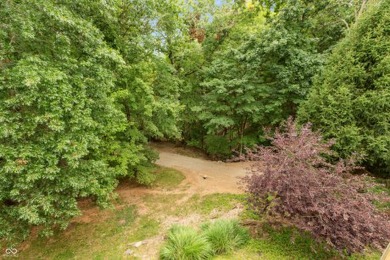 With a panoramic tree top woods view and partial season view of on The Eagle Pointe Golf Resort in Indiana - for sale on GolfHomes.com, golf home, golf lot