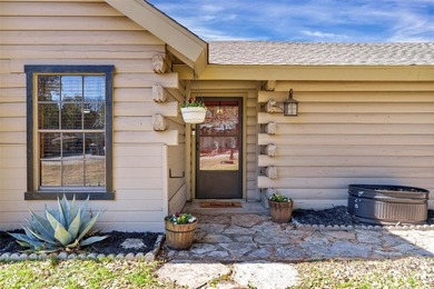 Warm, welcoming, and full of character, this log cabin style on De Cordova Bend Country Club in Texas - for sale on GolfHomes.com, golf home, golf lot