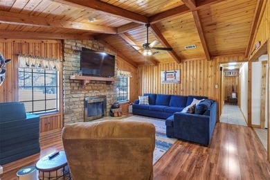 Warm, welcoming, and full of character, this log cabin style on De Cordova Bend Country Club in Texas - for sale on GolfHomes.com, golf home, golf lot