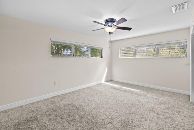 Experience serene, resort-style living in this stunning estate on Babe Zaharias Golf Course in Florida - for sale on GolfHomes.com, golf home, golf lot