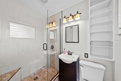Experience serene, resort-style living in this stunning estate on Babe Zaharias Golf Course in Florida - for sale on GolfHomes.com, golf home, golf lot