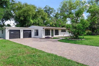 Experience serene, resort-style living in this stunning estate on Babe Zaharias Golf Course in Florida - for sale on GolfHomes.com, golf home, golf lot