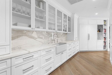 Beyond the private gates of Boca Grove Country Club, a residence on Boca Grove Golf and Tennis in Florida - for sale on GolfHomes.com, golf home, golf lot