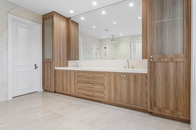 Beyond the private gates of Boca Grove Country Club, a residence on Boca Grove Golf and Tennis in Florida - for sale on GolfHomes.com, golf home, golf lot