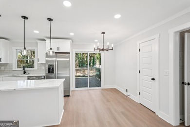 Luxury living on a budget! Picture a home that minds its on Browns Mill Golf Course in Georgia - for sale on GolfHomes.com, golf home, golf lot