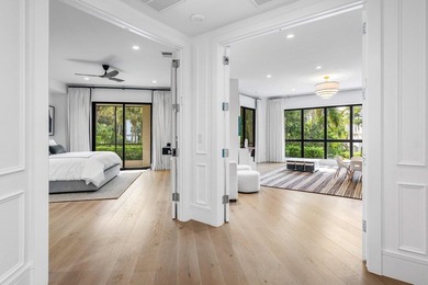 Beyond the private gates of Boca Grove Country Club, a residence on Boca Grove Golf and Tennis in Florida - for sale on GolfHomes.com, golf home, golf lot