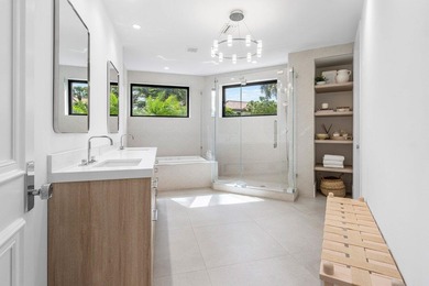 Beyond the private gates of Boca Grove Country Club, a residence on Boca Grove Golf and Tennis in Florida - for sale on GolfHomes.com, golf home, golf lot