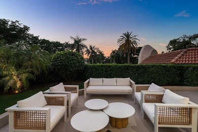 Beyond the private gates of Boca Grove Country Club, a residence on Boca Grove Golf and Tennis in Florida - for sale on GolfHomes.com, golf home, golf lot