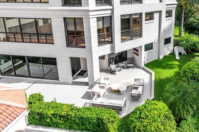 Beyond the private gates of Boca Grove Country Club, a residence on Boca Grove Golf and Tennis in Florida - for sale on GolfHomes.com, golf home, golf lot