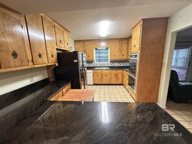 Spacious Gulf Shores Classic with Endless Potential! Discover on The Golf Club of the Wharf in Alabama - for sale on GolfHomes.com, golf home, golf lot