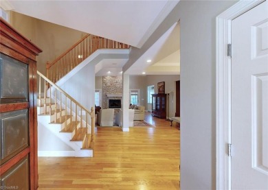 Enter the front door to view the beautiful great room w/stone on Salem Glen Country Club in North Carolina - for sale on GolfHomes.com, golf home, golf lot
