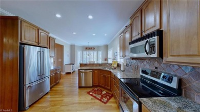 Enter the front door to view the beautiful great room w/stone on Salem Glen Country Club in North Carolina - for sale on GolfHomes.com, golf home, golf lot