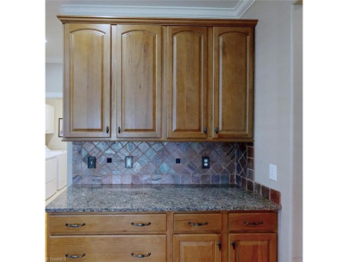 Enter the front door to view the beautiful great room w/stone on Salem Glen Country Club in North Carolina - for sale on GolfHomes.com, golf home, golf lot