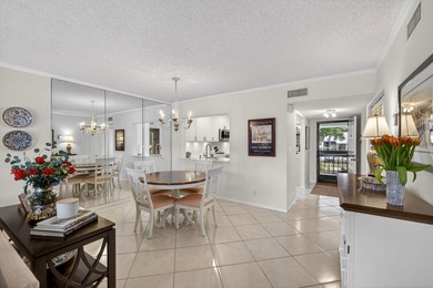 Beautifully updated 2-bedroom, 2-bath second-floor condo on Old Marsh Golf Club in Florida - for sale on GolfHomes.com, golf home, golf lot