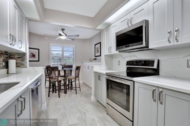 Move right into this tropical paradise of Wynmoor Village! Fully on Wynmoor Golf Course in Florida - for sale on GolfHomes.com, golf home, golf lot